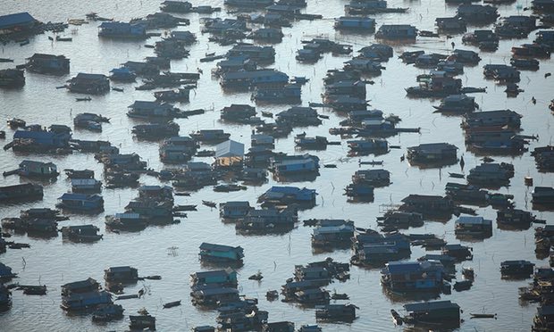 Chong Kneas village, Tonlé Sap, near Siem Reap. Such villages often lack sanitation, with waste deposited directly into the freshwater lake. Photograph: David Wall/Alamy