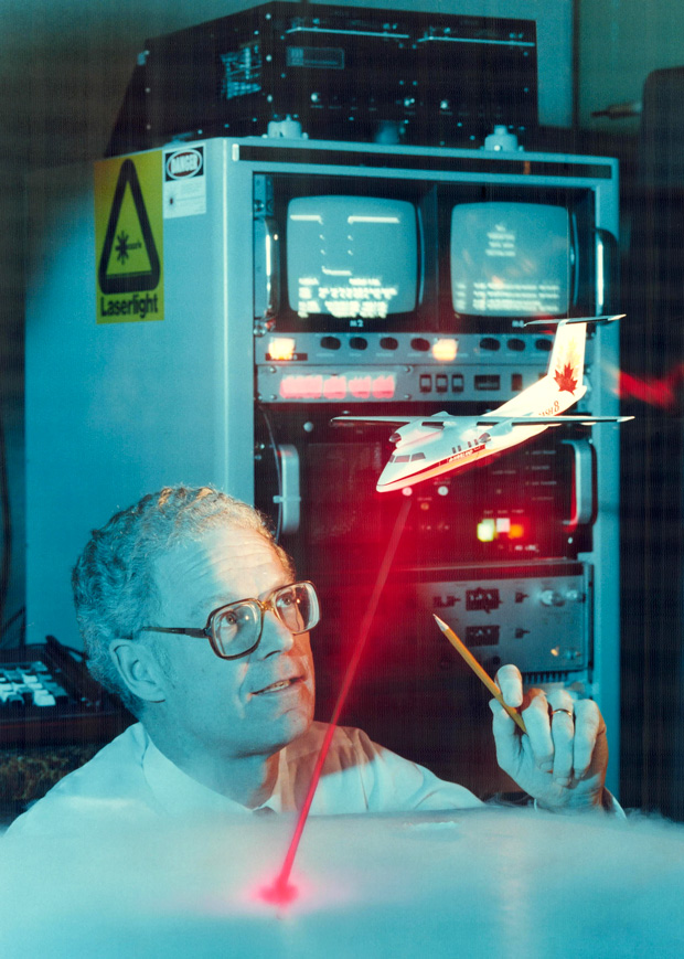 In this 1986 photo, Optech cofounder Allan Carswell considers a model of his company’s airborne laser system for mapping coastal waters in the Arctic.