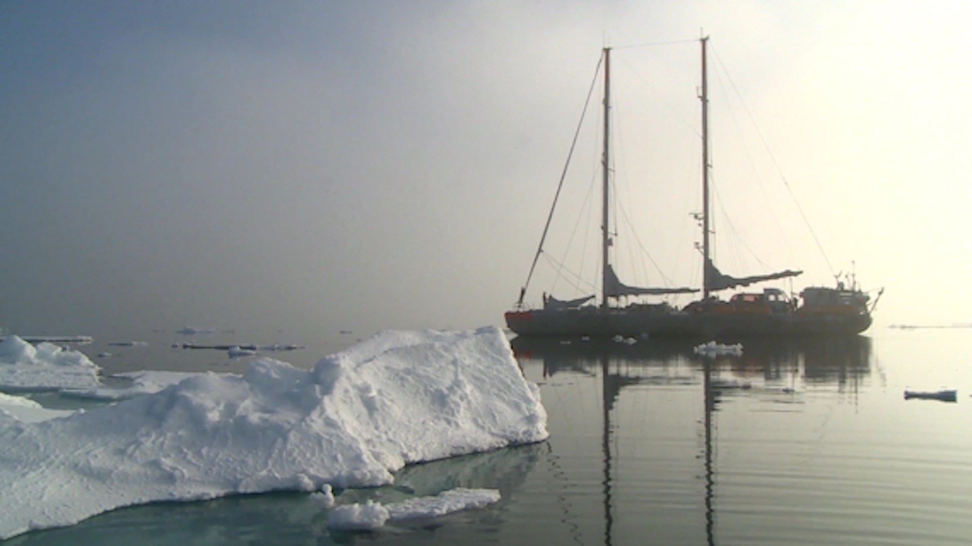 Deserted ship near iceberg